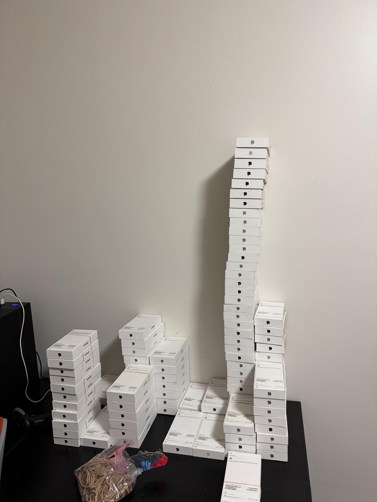 Stacked iPhone boxes ready for bulk sale